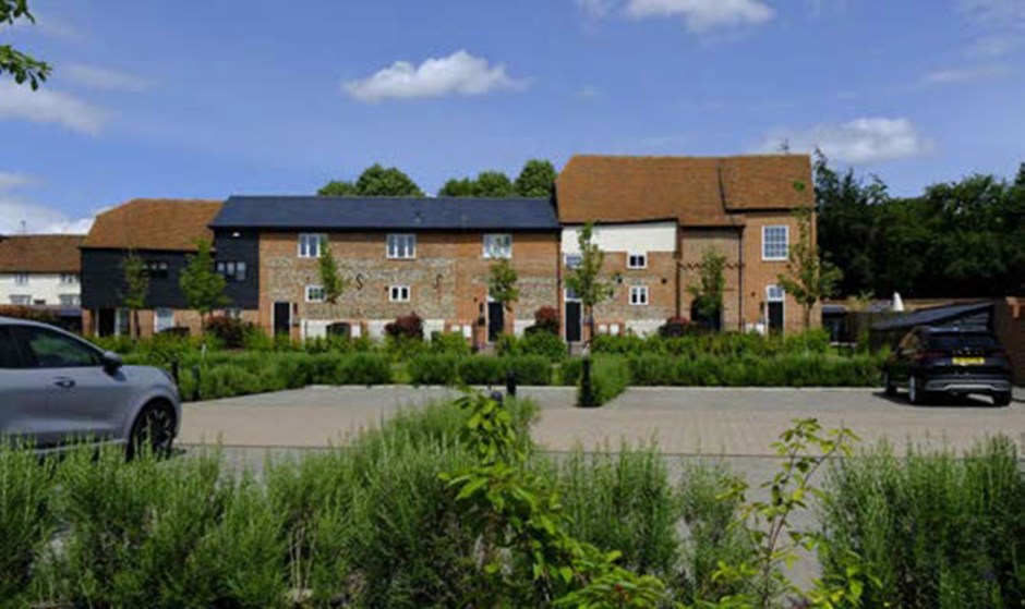 Retained heritage buildings provide a richness and variety to new residential development. Morris Dance Place, Thaxted.