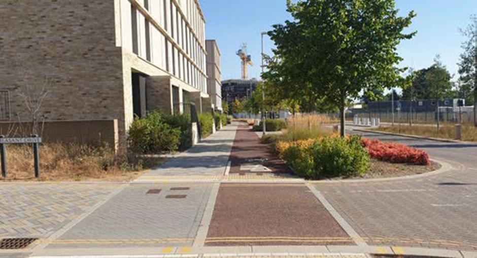 Segregated cycleway, with landscape buffer to vehicular corridor and clear priority for pedestrians and cyclists at junctions.