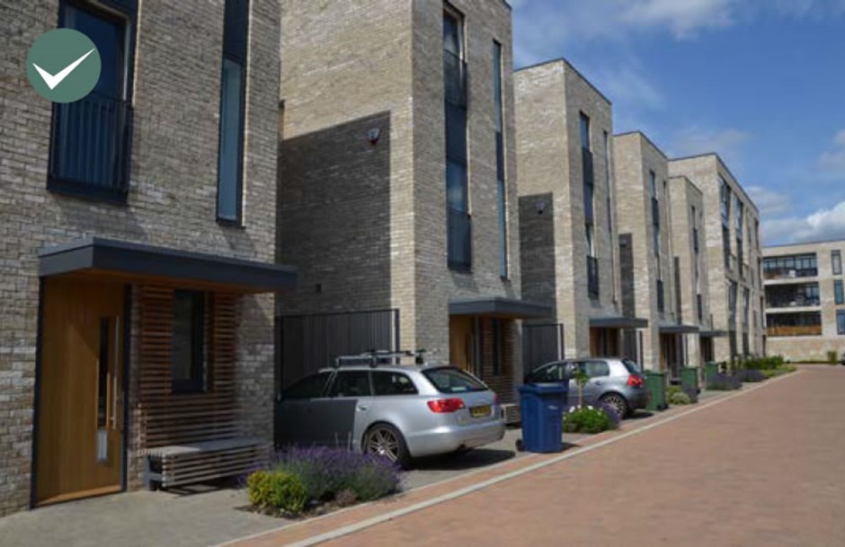 Visual impact of parking space projecting past the main building line is reduced with prominent planting and strong frontage.