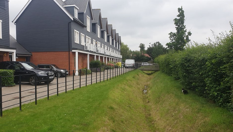 Beaulieu Park, Chelmsford. Rural lanes integrate with swale features and existing hedgerows, similar to the protected lanes of Uttlesford.