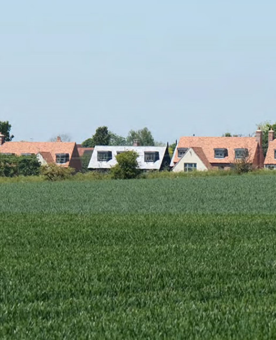 The dormer windows in Thorpe Lea Close, Great Chesterford overlook the adjacent open landscape.